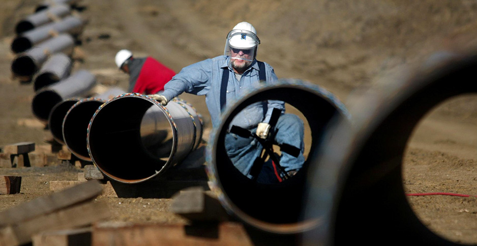 Welders work on natural gas pipeline. Photo credit: Tom Fox/KRT/Newscom 