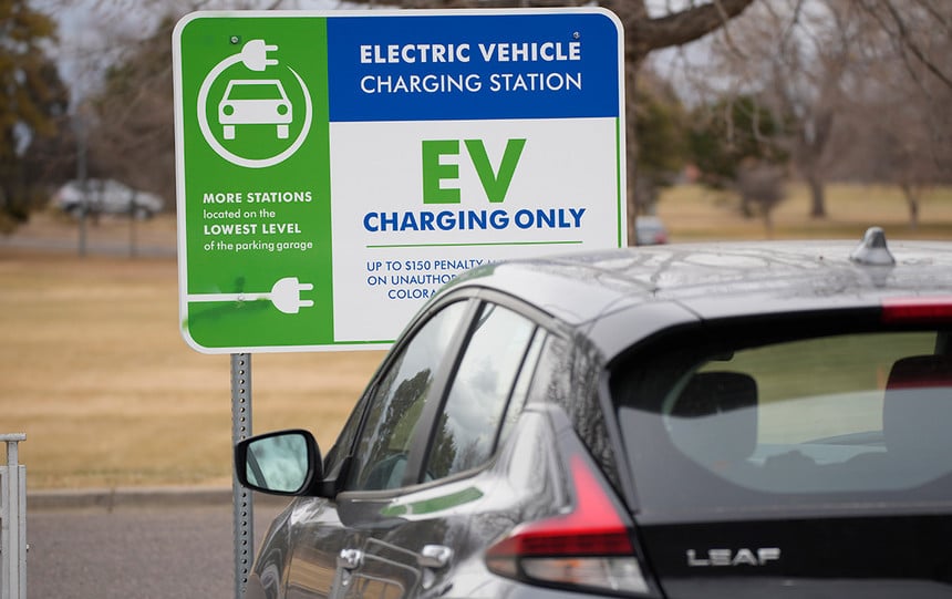 A Nissan Leaf charges at a recharge station outside the Denver Museum of Nature and Science.