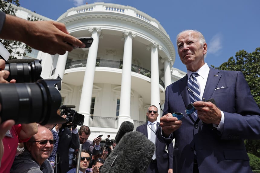 Joe Biden speaks to members of the press outside the White House