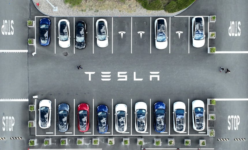 Tesla cars sit parked in a lot at the Tesla factory in Fremont, Calif., in April.