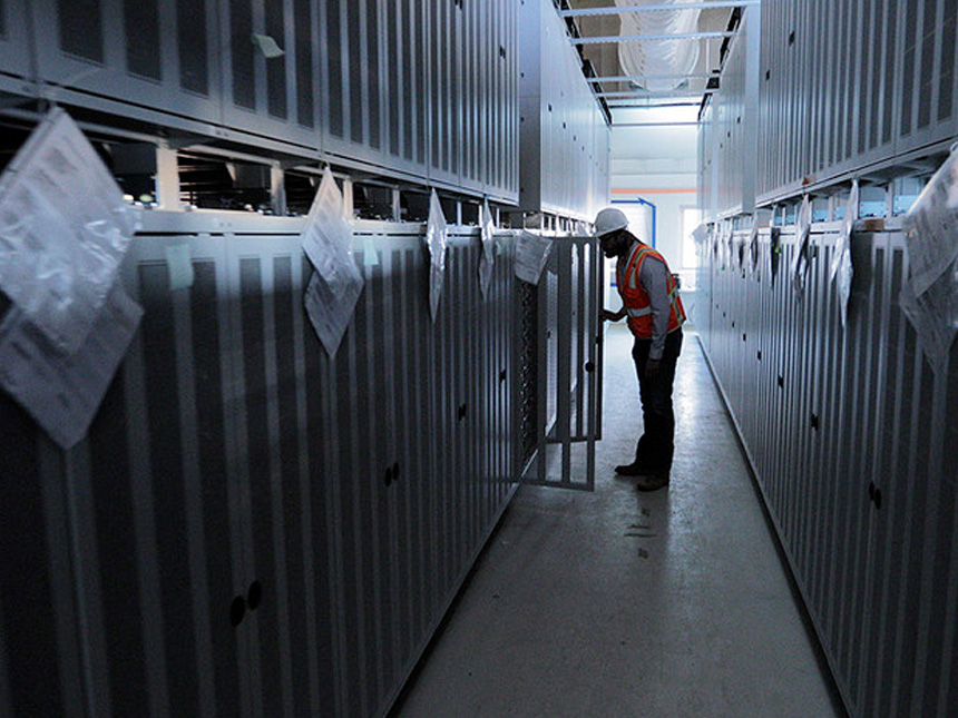 A worker at the Moss Landing energy storage facility in California.